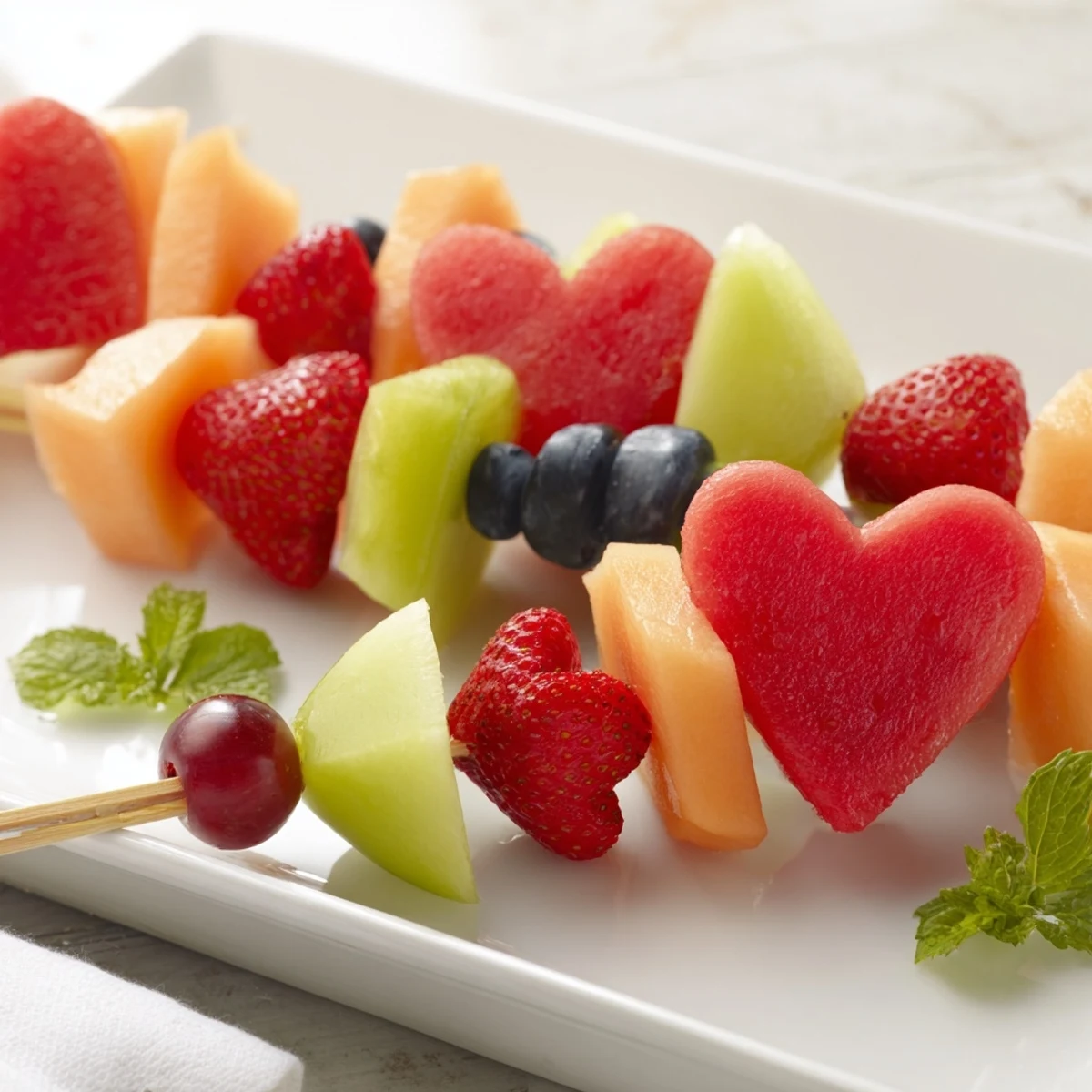 Vibrantly colored Berry Good Heart Fruit Skewers offer a refreshing, healthy treat, ready to enjoy.