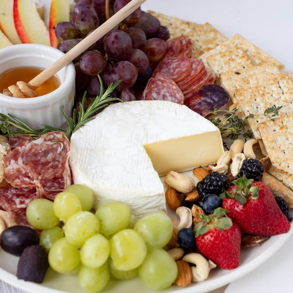 This Quick Charcuterie Snack Board provides a delicious mix of cheeses, meats and fruit, ideal for sharing.
