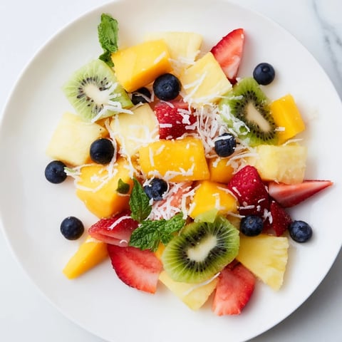 Vibrant tropical pineapple platter with colorful fruits, a perfect summer refreshing dessert.