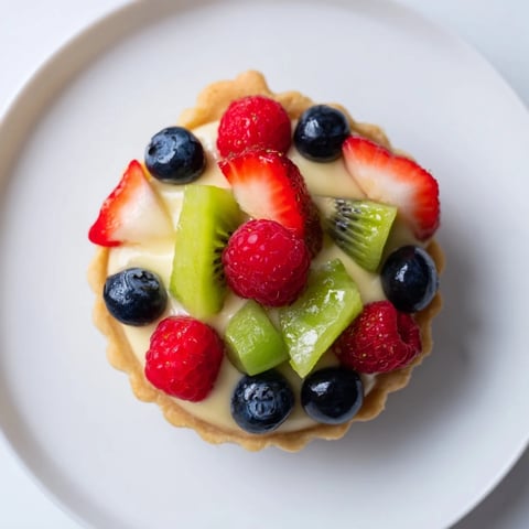 Mini Fruit Tartlets in a Circle Arrangement, with colorful fruit topping, ready to eat.