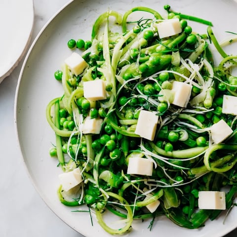 Vibrant English Ivy salad, featuring green beans, snap peas, and cheddar, ready to serve and enjoy.