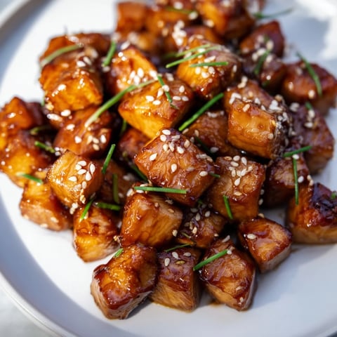 Golden, caramelized Air Fryer Turkey Bites, perfect appetizer with sesame seeds and chives, savory-sweet.