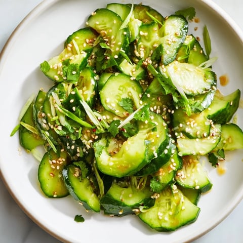 Crisp Zesty Shake Cucumber Salad with sesame seeds, a vibrant Asian-inspired side dish.