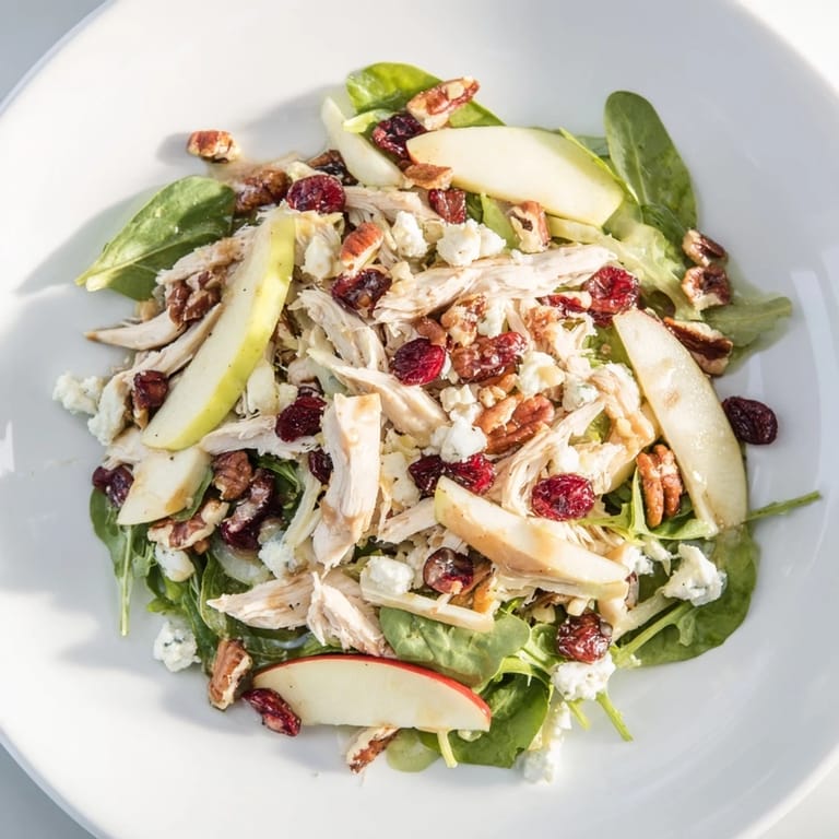 Enjoy a refreshing bowl of Chicken and Apple Winter Salad, perfect for a light lunch or dinner.