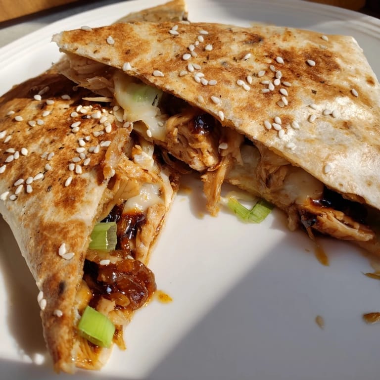 Close-up of a perfectly grilled and tempting Korean BBQ Chicken Wrap Grilled Cheese, a delicious main dish.